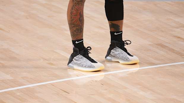 Grey and black Yeezy basketball shoes.